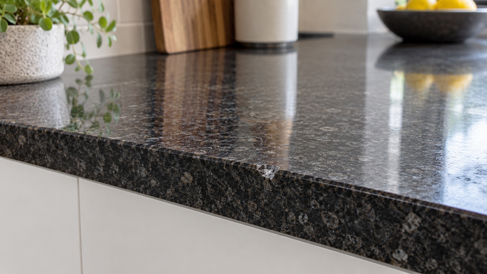 Photorealistic granite kitchen worktop with a small chip on the front edge